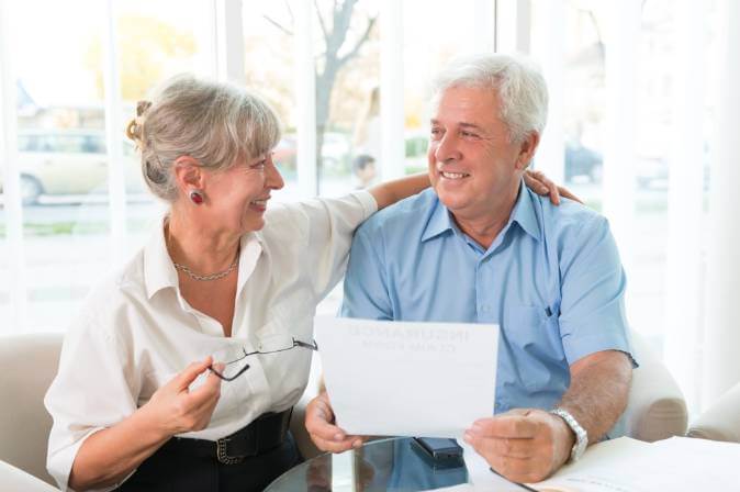 Mature couple discussing what is an IUL and if it is the right life insurance policy for them